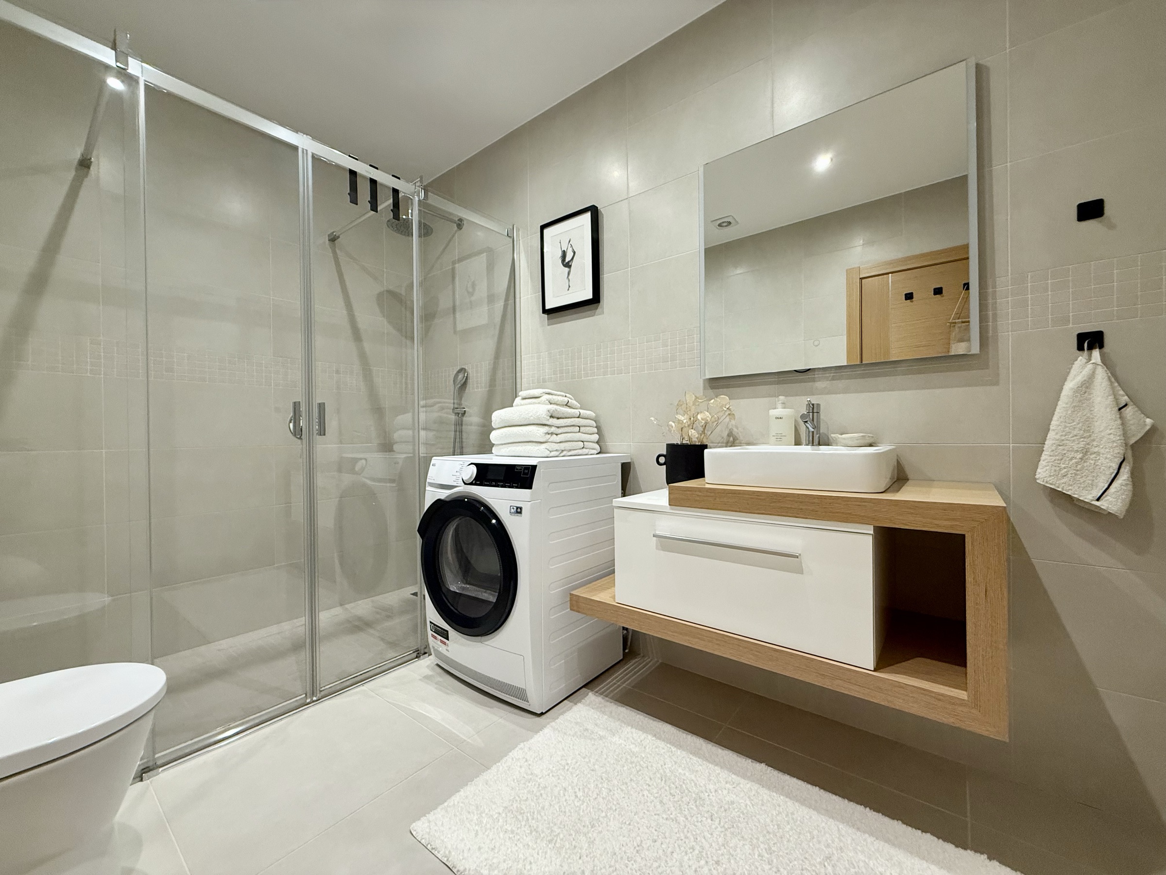 En-suite bathroom with laundry area